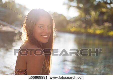 Stock Image - "Portrait of young woman at pool, Panay Island, Visayas, Philippines". Fotosearch