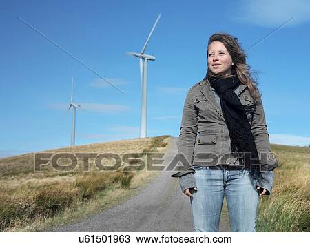Portrait of young woman at windfarm View Large Photo Image Stock Image - Portrait of young woman at windfarm. Fotosearch