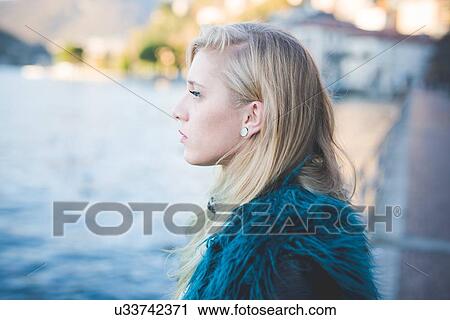 "Portrait of young woman looking out at Lake Como, Como, Italy" View Large Photo Image Stock Image - "Portrait of young woman looking out at Lake Como, Como, Italy". Fotosearch