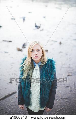 "Portrait of young woman looking up from Lake Como, Como, Italy" View Large Photo Image Picture - "Portrait of young woman looking up from Lake Como, Como, Italy". Fotosearch
