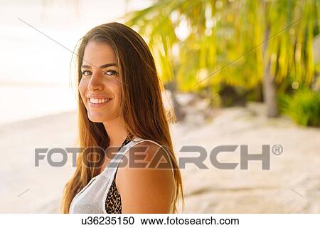 Stock Image - "Portrait of young woman on Anda beach, Bohol Province, Philippines". Fotosearch