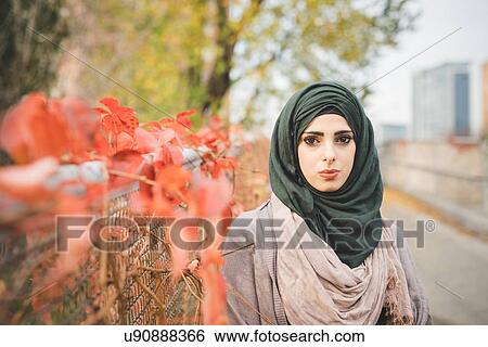 Portrait of young woman on park path View Large Photo Image Stock Photograph - Portrait of young woman on park path. Fotosearch