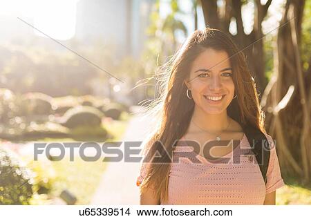 "Portrait of young woman strolling in park, Manila, Philippines" View Large Photo Image Picture - "Portrait of young woman strolling in park, Manila, Philippines". Fotosearch