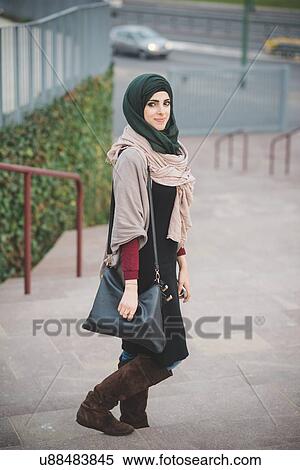 Portrait of young woman wearing hijab on stairway View Large Photo Image Stock Photography - Portrait of young woman wearing hijab on stairway. Fotosearch