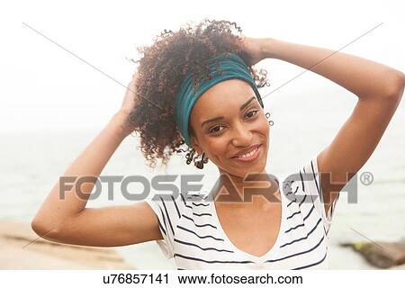 "Portrait of young woman with hands in hair, Ipanema beach, Rio De Janeiro, Brazil" View Large Photo Image Stock Image - "Portrait of young woman with hands in hair, Ipanema beach, Rio De Janeiro, Brazil". Fotosearch