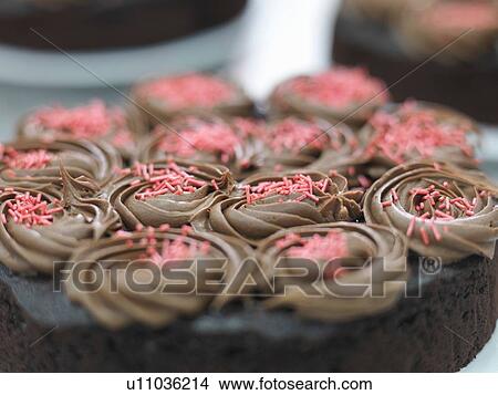 "Prepared cake in cake factory, close up" View Large Photo Image Picture - "Prepared cake in cake factory, close up". Fotosearch