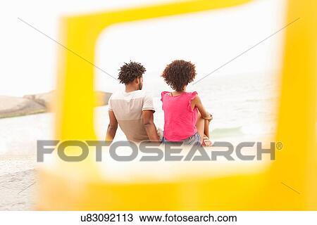 "Rear view of couple looking out to sea on Ipanema Beach, Rio De Janeiro, Brazil" View Large Photo Image Stock Image - "Rear view of couple looking out to sea on Ipanema Beach, Rio De Janeiro, Brazil". Fotosearch