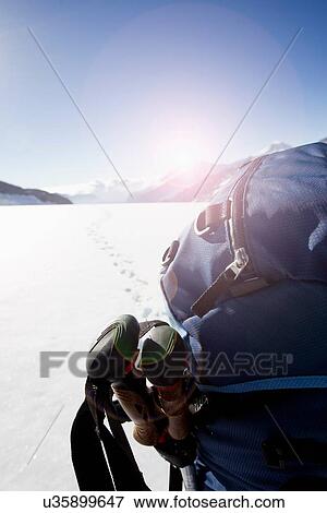 "Rear view of male hikers backpack in snow covered landscape, Jungfrauchjoch, Grindelwald, Switzerland" View Large Photo Image Stock Photo - "Rear view of male hikers backpack in snow covered landscape, Jungfrauchjoch, Grindelwald, Switzerland". Fotosearch