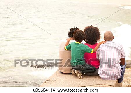 "Rear view of mature man and family looking out to sea on Ipanema Beach, Rio De Janeiro, Brazil" View Large Photo Image Picture - "Rear view of mature man and family looking out to sea on Ipanema Beach, Rio De Janeiro, Brazil". Fotosearch
