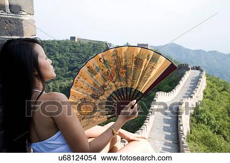 "Rear view of mid adult female tourist holding fan on the Great Wall of China, Beijing, China" View Large Photo Image Picture - "Rear view of mid adult female tourist holding fan on the Great Wall of China, Beijing, China". Fotosearch