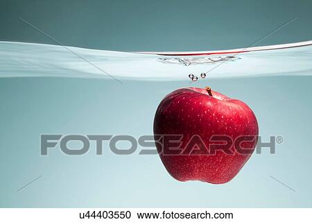 Red apple underwater View Large Photo Image Stock Image - Red apple underwater. Fotosearch