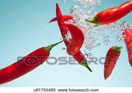 Red chillies underwater View Large Photo Image Stock Image - Red chillies underwater. Fotosearch