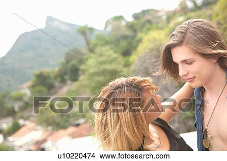 "Romantic young couple on rooftop terrace, Rio De Janeiro, Brazil" View Large Photo Image Picture - "Romantic young couple on rooftop terrace, Rio De Janeiro, Brazil". Fotosearch