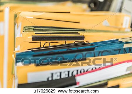 Stock Photo - Rows of paper files. Fotosearch