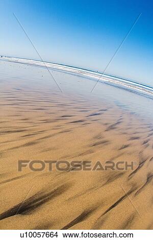 Sand with ocean in distance View Large Photo Image Picture - Sand with ocean in distance. Fotosearch