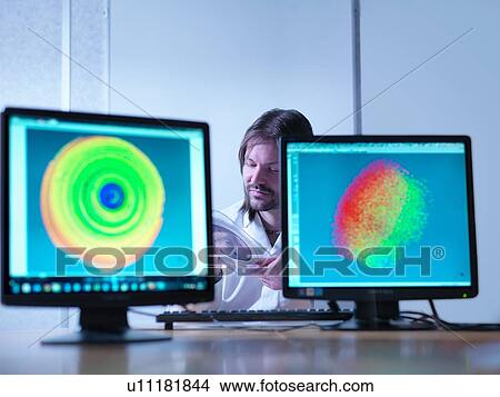 Scientist checking test map of silicon wafer in laboratory View Large Photo Image Picture - Scientist checking test map of silicon wafer in laboratory. Fotosearch
