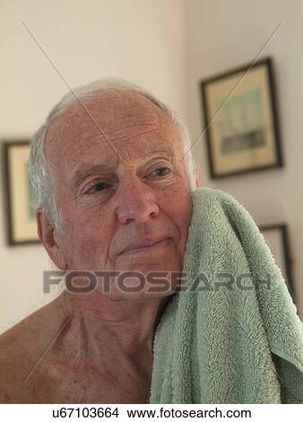 Senior man drying face with towel View Large Photo Image Picture - Senior man drying face with towel. Fotosearch