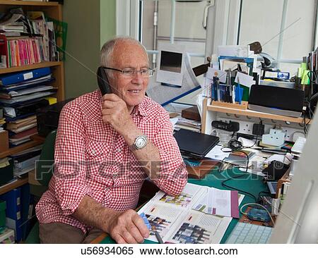Senior man on phone in home office View Large Photo Image Stock Photography - Senior man on phone in home office. Fotosearch