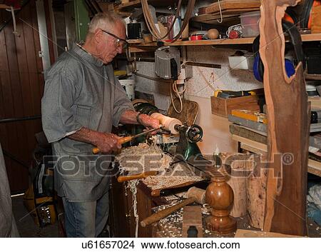 Senior man shaping piece of wood with carpentry tools View Large Photo Image Picture - Senior man shaping piece of wood with carpentry tools. Fotosearch