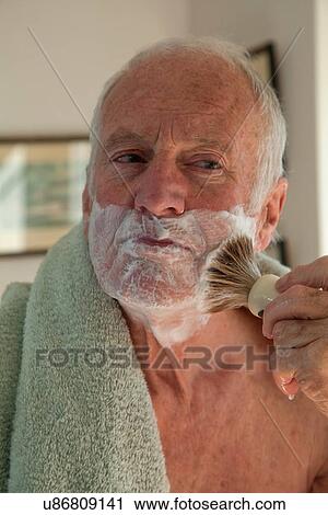 Senior man using shaving brush View Large Photo Image Stock Image - Senior man using shaving brush. Fotosearch