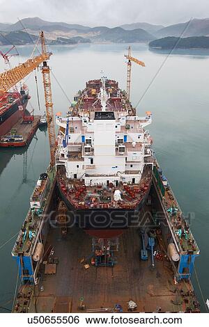 Stock Photograph - "Ships at port, GoSeong-gun, South Korea". Fotosearch