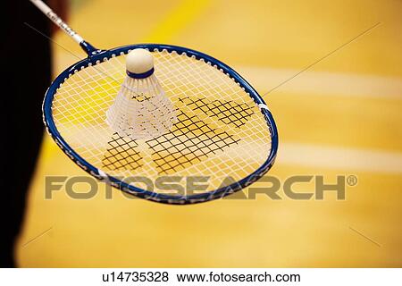 Shuttlecock on top of badminton racket View Large Photo Image Stock Photo - Shuttlecock on top of badminton racket. Fotosearch