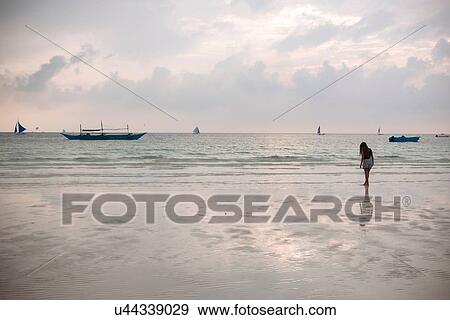 "Silhouetted young woman on white beach, Boracay Island, Visayas, Philippines" View Large Photo Image Stock Photo - "Silhouetted young woman on white beach, Boracay Island, Visayas, Philippines". Fotosearch