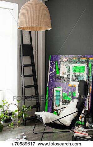 Stock Photo - Sitting room with vintage styled armchair and abstract painting. Fotosearch