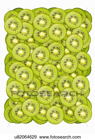 Slices of Kiwi fruit View Large Photo Image Stock Photo - Slices of Kiwi fruit. Fotosearch