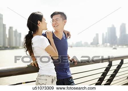 "Smiling tourist couple on bridge, The Bund, Shanghai, China" View Large Photo Image Stock Photo - "Smiling tourist couple on bridge, The Bund, Shanghai, China". Fotosearch