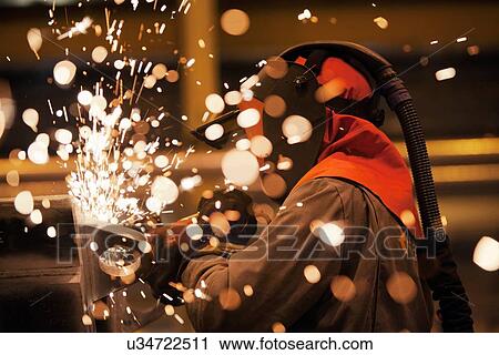 Sparks and worker using grinder View Large Photo Image Stock Image - Sparks and worker using grinder. Fotosearch