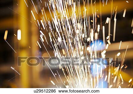 Stock Photograph - Sparks flying in factory. Fotosearch