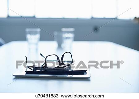 "Spectacles, digital tablet and smartphone on conference table" View Large Photo Image Stock Image - "Spectacles, digital tablet and smartphone on conference table". Fotosearch