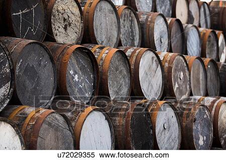 Stock Photography - Stack of wooden whisky casks. Fotosearch