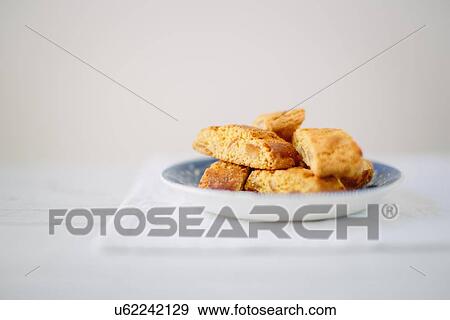 Stock Photo - Still life of almond cantucci biscuits on plate. Fotosearch