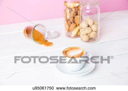 Still life of cup of coffee and cookie jars View Large Photo Image Stock Image - Still life of cup of coffee and cookie jars. Fotosearch
