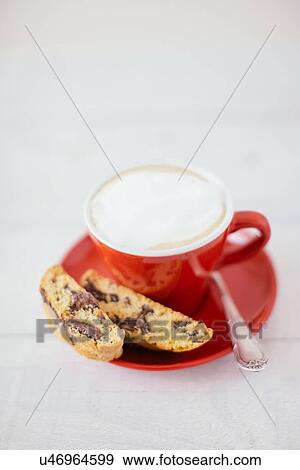 Still life of cup of latte and chocolate cantucci biscuits View Large Photo Image Stock Photo - Still life of cup of latte and chocolate cantucci biscuits. Fotosearch