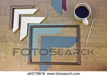 Still life of frames and coffee in picture framers workshop View Large Photo Image Stock Photo - Still life of frames and coffee in picture framers workshop. Fotosearch