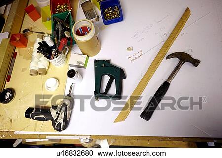 Stock Image - Still life of workbench in picture framers workshop. Fotosearch