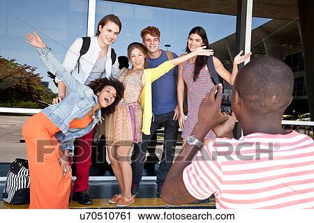 Student photographer taking picture of friends View Large Photo Image Stock Image - Student photographer taking picture of friends. Fotosearch