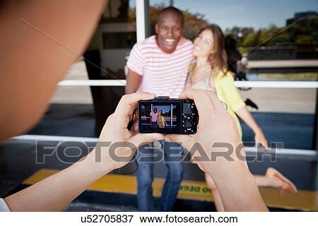 Student photographer taking picture of friends View Large Photo Image Stock Photo - Student photographer taking picture of friends. Fotosearch