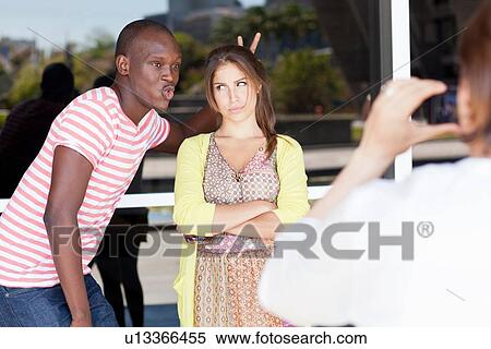 Student photographer taking picture of friends View Large Photo Image Stock Photography - Student photographer taking picture of friends. Fotosearch