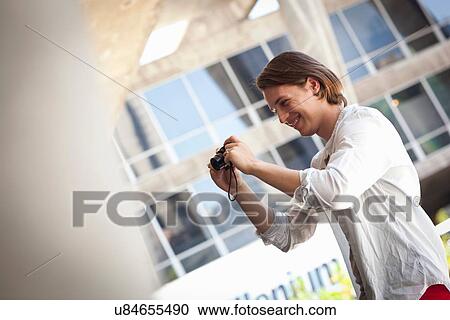 Student photographer taking picture View Large Photo Image Stock Image - Student photographer taking picture. Fotosearch