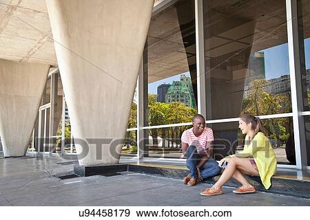 Stock Photo - Students chatting outside. Fotosearch
