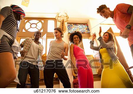 "Students dancing, view from below" View Large Photo Image Stock Photograph - "Students dancing, view from below". Fotosearch
