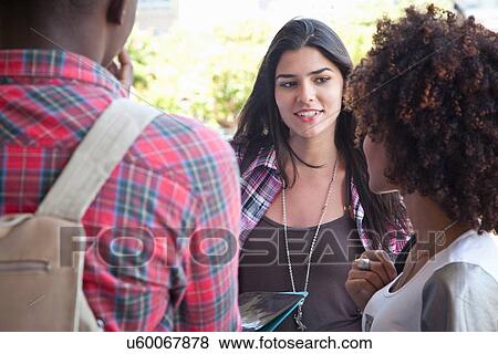 Stock Photo - Students friends talking. Fotosearch