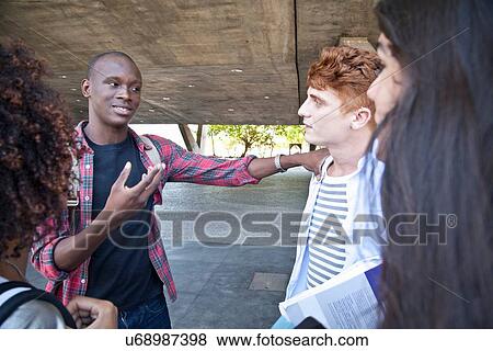Stock Photo - Students friends talking. Fotosearch