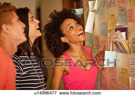 Students looking at notice board View Large Photo Image Stock Photo - Students looking at notice board. Fotosearch