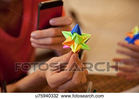 Students playing origami paper game View Large Photo Image Stock Image - Students playing origami paper game. Fotosearch