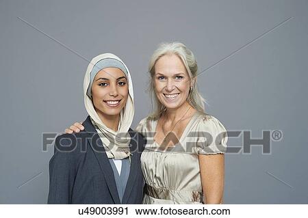 Studio portrait of two businesswomen View Large Photo Image Stock Image - Studio portrait of two businesswomen. Fotosearch